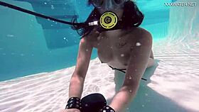 Brita piskova masturbates her tight pussy underwater in the pool