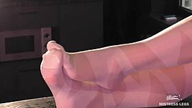 Goddess In White Pantyhose Teases Nylon Feet And Toes On Table