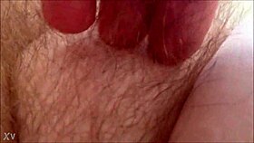 Rubbing her hairy milf pussy