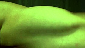 Busty redhead bodybuilder flexes while riding cock