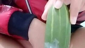 vietnamese teen girl masturbates using a cucumber in this homemade scene