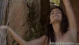 Tattooed babe strips, teasing with her natural tits and shaved pussy