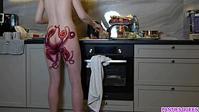 i feel so emotional watching this naked housewife with octopus tattoo on ass cook dinner in the kitchen