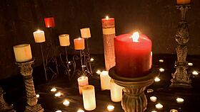 What ritual involves candles and masturbation?