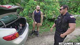 cop gets a surprising pull over from muscular hunk in uniform