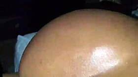 Ebony woman bent over in oiled doggystyle position with moaning