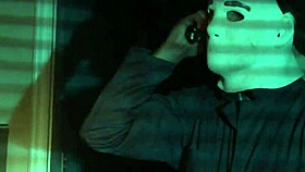 A sexy nude girl celebrates Halloween in bed.