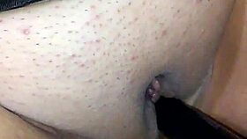 face mask on, black dildo in mouth