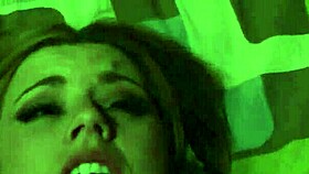 A sexy nude girl celebrates Halloween in bed.