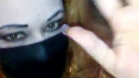 face mask on, black dildo in mouth