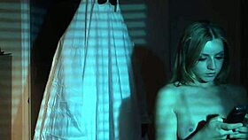 A sexy nude girl celebrates Halloween in bed.