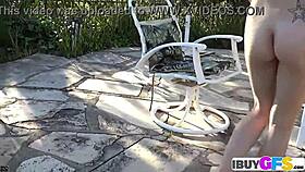 Hot brunette masturbates outdoors