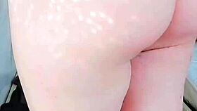 this cute bbw sissy crossdresser in pink shirt and black mini skirt shows off her big butt on webcam