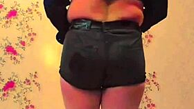 this cute bbw sissy crossdresser in pink shirt and black mini skirt shows off her big butt on webcam