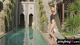 Big-boobed Ashleigh Hannah strips to show her stunning pussy by the pool