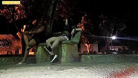 A broke guy skips the motel and gets wild sex with two girls in the public square after a party.