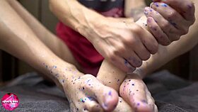 babe gives sensual footjob with rubber cock fetish