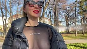 Wow, this beauty flashes her big boobs while walking in a public park!