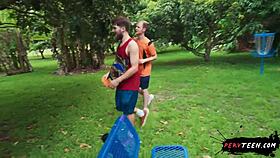 two people engage in intimate activities in a public park despite passersby