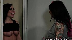 Emo lesbian with tattoos explores alternative goth style.