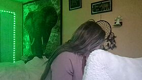 Naejae is rubbing her wet pussy while watching lesbian porn on the screen.