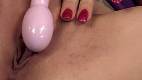 janessa jordan, the dark-haired slut, slides a sex toy into her pussy