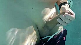 Gay guy jerks fat cock in public thermal pool underwater fun