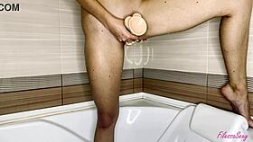 Cute Babe Fingers Pussy With Dildo In Bathroom!