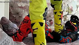 Gay biker treads boots in motocross
