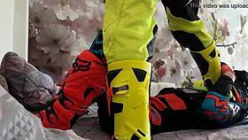 Gay biker treads boots in motocross
