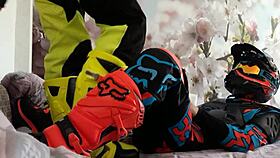 Gay biker treads boots in motocross