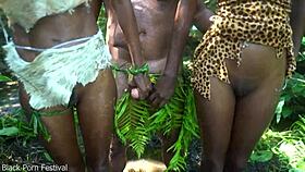 Two African tribal girls sneak off with the village chief for forest fun. Their skinny frames heat up the wild!