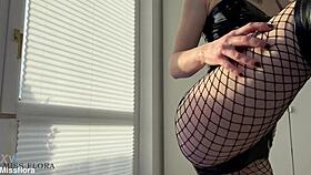 Latex Tease In Fishnets And Boots