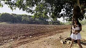 Monika Fox shamelessly shows tits and pees outdoors by a tree