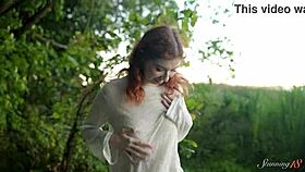 Watch teen redhead Mia finger pussy to orgasm by lake.