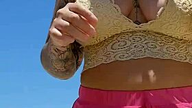 African babe flashes big pussy lips at beach lover