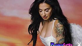 Angel Joanna Angel strips naked, showing off her sexy tattoos.