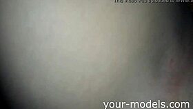 Beautiful brunette caresses her pussy solo at home.