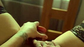 Blonde in stockings flashes pussy at window while dirty talking and ripping clothes