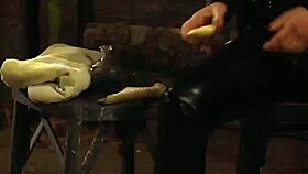 Horny madame fingers bent-over lesbian slave's wet pussy