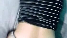 In a homemade webcam setup, a Latina emo milf shares a POV moment on a big bed using a notebook for connection.