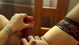 Blonde in stockings flashes pussy at window while dirty talking and ripping clothes