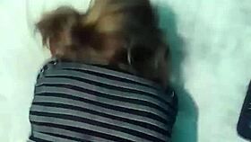 In a homemade webcam setup, a Latina emo milf shares a POV moment on a big bed using a notebook for connection.