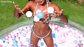 Putri Cinta Strips Bare in Indonesian Pool Scene