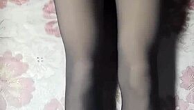 asian crossdresser strokes hard in black pantyhose and jeans.