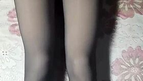 asian crossdresser strokes hard in black pantyhose and jeans.