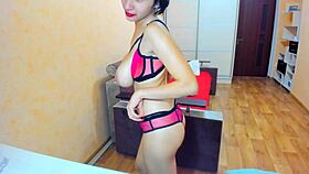 She says, 'Watch my dildo play in high heels and pink lingerie.'