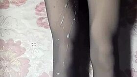 asian crossdresser strokes hard in black pantyhose and jeans.