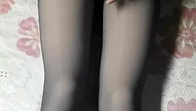 asian crossdresser strokes hard in black pantyhose and jeans.