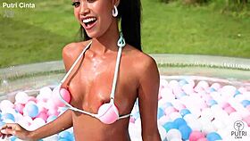 Putri Cinta Strips Bare in Indonesian Pool Scene